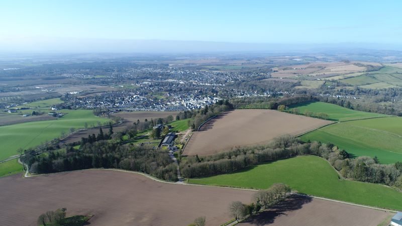 High view over the estate fields towards the town